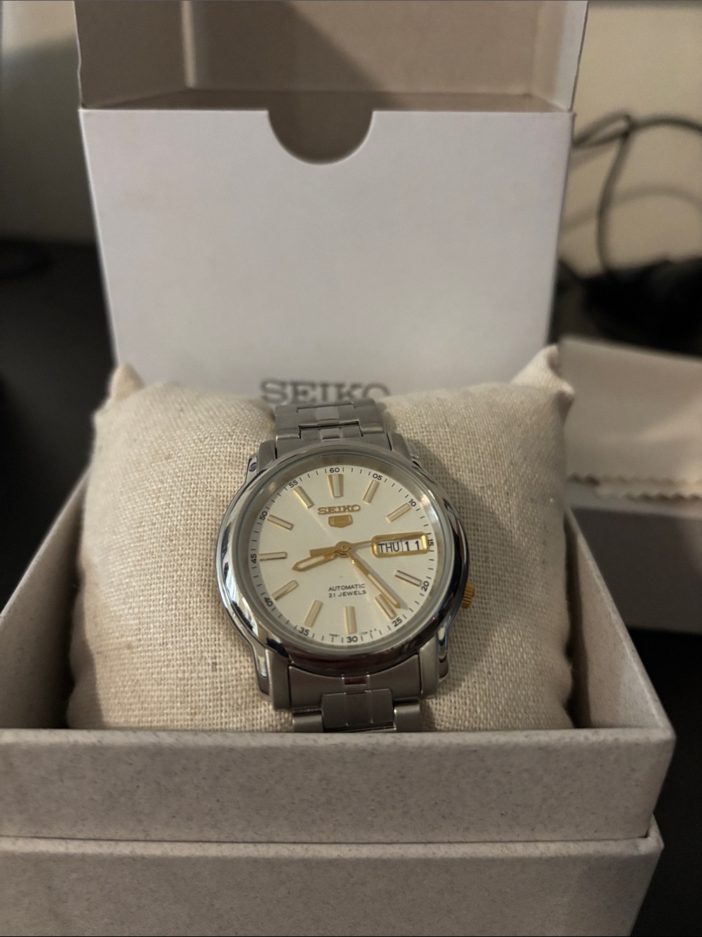 Seiko Men’s Silver Watch with Cream Dial and Gold Accents